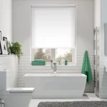 Roller blinds in white light filter in bathroom