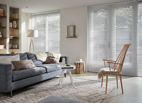 White venetian blinds in earth colour living room