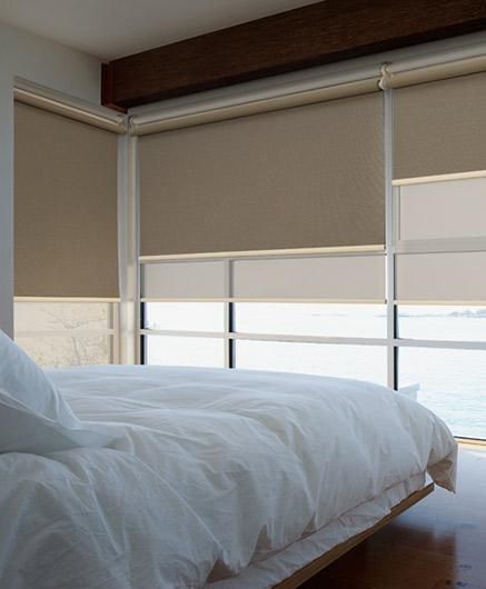 Dual roller blinds in bedroom